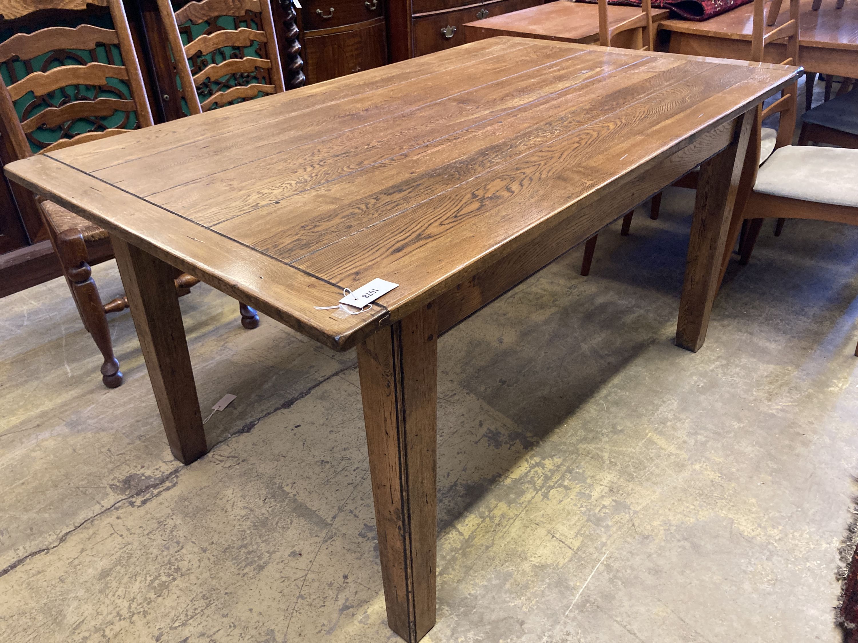 A 19th century style rectangular oak dining table with planked top, length 153cm, depth 90cm, height 77cm